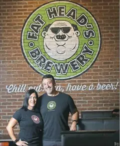  ??  ?? Owners Michelle and Glenn Benigni of Fat Head’s Saloon on the South Side.