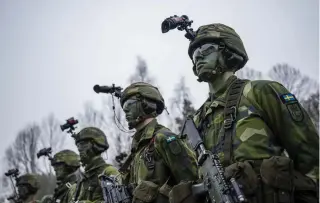  ?? AFP PHOTO ?? READY FOR ACTION
Members of Sweden’s Armed Forces stand in formation during a military exercise in Kungsangen locality, near the capital Stockholm, on Tuesday, Feb. 27, 2024.