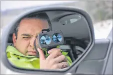  ?? ASHLEY THOMPSON/SALTWIRE NETWORK ?? Sgt. Andrew Buckle with the Nova Scotia RCMP uses a LIDAR unit to catch speeders.