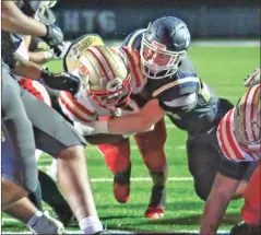  ?? Greg Spell, Cherokee Tribune ?? Rome senior running back EJ Lackey muscles his way into the end zone for a touchdown during the Wolves’ Sweet 16 game against the River Ridge Knights on Friday in Woodstock.