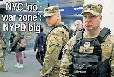  ?? ?? ‘THEATER’: The National Guard patrols Penn Station on Thursday as state cops assist with bag checks (below), a day after Gov. Hochul abruptly announced their deployment to the subways to crack down on crime.