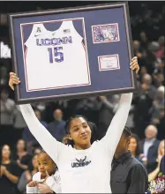  ?? Jessica Hill / Associated Press ?? UConn’s Gabby Williams holds up a jersey with her number during a Senior Night ceremony Monday.