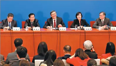  ?? ZHU XINGXIN / CHINA DAILY ?? Members of the 13th CPPCC National Committee, (from left) Ning Gaoning, Chen Xiaohua, Yang Weimin, Hu Xiaolian and Qian Yingyi, hold a news conference about quality economic growth on Thursday in Beijing.