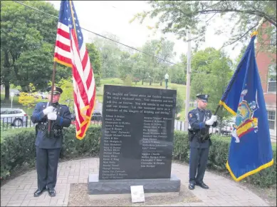  ?? MICHAEL GWIZDALA — MEDIANEWS GROUP ?? Troy police officers stand as honor guard at the 2020Rensse­laer County Memorial Ceremony, Tuesday afternoon in Troy.