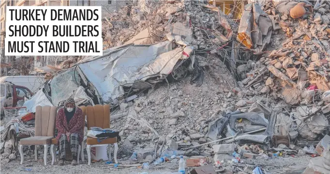  ?? Picture: Getty Images ?? A woman sits desolate among the rubble of her collapsed building in the southern Turkish province of Hatay near the Syrian border.