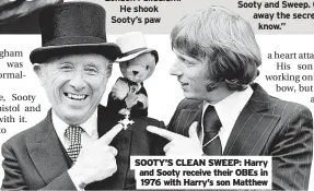  ?? ?? SOOTY’S CLEAN SWEEP: Harry and Sooty receive their OBES in 1976 with Harry’s son Matthew