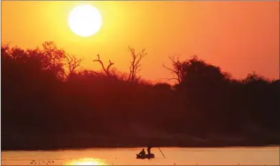  ?? PIC: MBONGENI MGUNI ?? Golden hour: Namibian fishermen on the Chobe River which separates Botswana and Namibia. Both countries are pushing for greater wildlife trade at the upcoming CITES meeting scheduled for Panama City in November