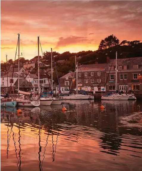  ?? Andy Haslam / New York Times ?? d mystery have long drawn tourists to Cornwall; Padstow boasts pastel-painted houses and world-renowned seafood.