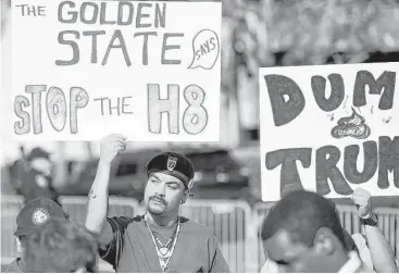  ?? Josh Edelson / AFP/Getty ?? Michael Garcia, left, was among those protesting against Donald Trump on Friday in Burlingame, Calif., where the presidenti­al candidate addressed the state’s GOP convention. With the state’s primary more than a month away, Trump likely will make many...