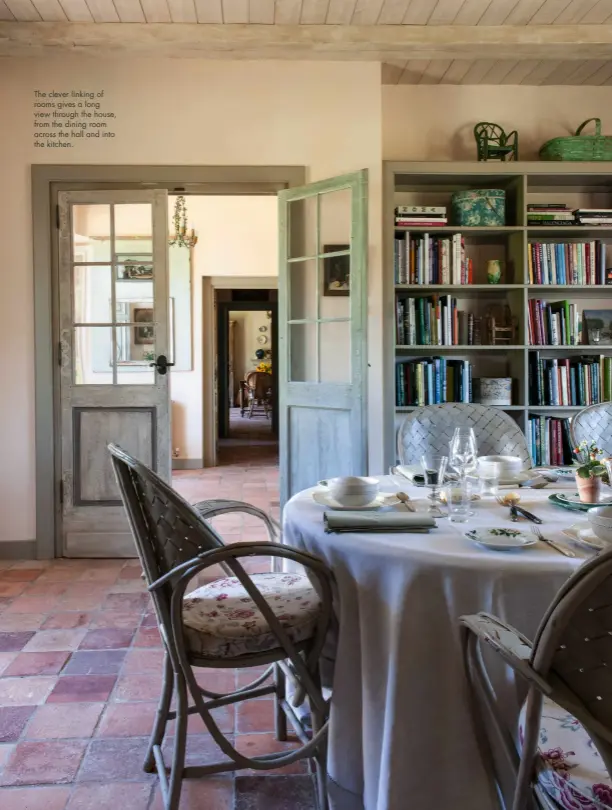  ??  ?? The clever linking of rooms gives a long view through the house, from the dining room across the hall and into the kitchen.