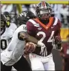  ?? MICHAEL SHROYER / GETTY IMAGES ?? Wake Forest’s Nasir Greer strips the ball from Virginia Tech running back Terius Wheatley in the first half of the Hokies’ win.