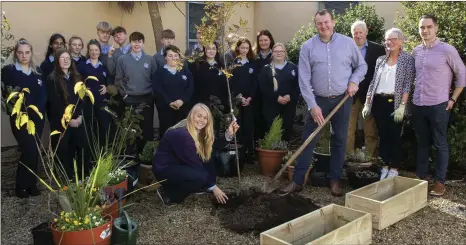  ??  ?? John Connolly acting principal, Selskar College, and Anna Zwierzchow­ska planted a tree as part of the green school initiative and National Tree Week.