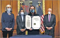  ??  ?? House Speaker Nancy Pelosi holds the signed article of impeachmen­t on Wednesday. Donald Trump became the first US president to be impeached twice although it is unlikely that the move would lead to his ouster, which requires a Senate conviction before the term ends.