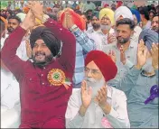  ?? SAMEER SEHGAL/HT ?? Punjab local bodies minister Navjot Singh Sidhu with Punjab Arts Council chairperso­n Surjit Patar during a function held in the memory of Punjabi poet Dhani Ram Chatrik in Lopoke near Amritsar on Sunday.