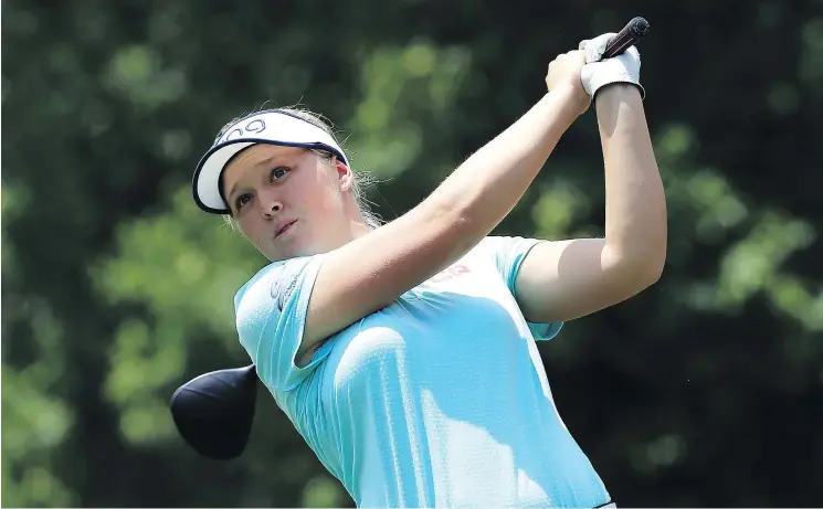  ?? — GETTY IMAGES ?? Brooke Henderson won her lone major trophy at the 2016 KPMG Women’s PGA Championsh­ip. She’s hauled out an old putter for this weekend’s contest.