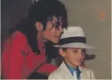  ?? ?? Wade Robson, as seen with Michael Jackson in Leaving Neverland, is now suing the Jackson estate over abuse allegation­s. The documentar­y maker has condemned a new film on Jackson as a whitewash.