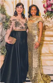  ?? ?? Dr. Alice Mao Brams and Roslyn Bazzelle Mitchell dazzle in metallic gowns.