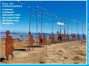  ?? ?? HILL OF FORGIVENES­S A process of pilgrims’ silhouette­s mark the crest of Alto de Perdón near Pamplona.