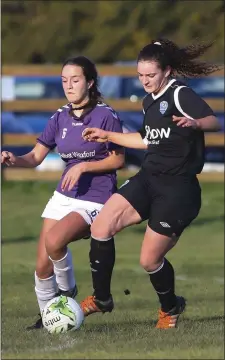  ??  ?? Lauren Roche of the Wexford League Under-18s battles for possession against the Metropolit­an League.