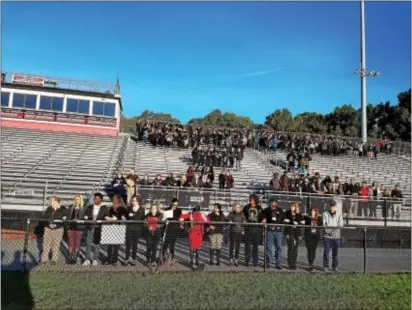  ?? SUBMITTED PHOTO ?? Coatesvill­e High School students take part in a unity event Friday morning to give students a voice and bring attention to several recent racial incidents involving the school.