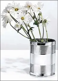  ??  ?? Tiffany Tiffany is selling a line of Everyday Objects including this $1,500 coffee can. Flowers not included.