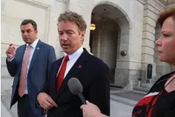  ?? Associated Press ?? Sen. Rand Paul, R-Ky., talks with a reporter Sunday as he leaves the Capitol following his address to the Senate in Washington. The Senate was unable to make a deal to extend contested anti-terror provisions and as a result, the post-Sept. 11 programs...