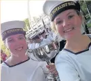  ??  ?? Jasmine Wilkinson (right) and a fellow cadet with one of the many trophies won by the crew of TS Royalist
