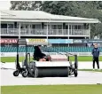  ??  ?? A blotter clears water at a rain-hit Vitality T20 Blast match in Leicester on Thursday