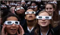  ?? File photo ?? Students wear special glasses in order to view a recent solar eclipse.