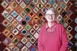  ?? JASON GETZ / SPECIAL TO THE AJC ?? Quiltmaker Maryagnes Kerr is shown with one of her pieces at Clairmont Place.