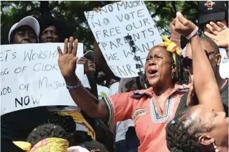  ?? OUPA MOKOENA African News Agency (ANA) ?? MEMBERS of the Enlighten Christian Gathering Church led by fraud and money laundering accused Shepherd Bushiri and his wife Mary, show support by singing and praying outside the Specialise­d Commercial Crimes Court in Pretoria. |