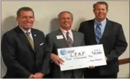  ?? SUBMITTED ?? Senator John J. Eklund (left) and Lake/Geauga Educationa­l Assistance Foundation Executive Director David Cowen (center) accept a check for $2,000 from AT&T External Affairs Director Kevin Lynch