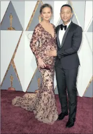  ??  ?? A pregnant Chrissy Teigen and John Legend arrive for the 88th annual Academy Awards ceremony at the Dolby Theater in Hollywood last year.