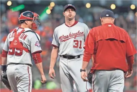  ?? ED SZCZEPANSK­I, USA TODAY SPORTS ?? A Cy Young favorite earlier this season, Nationals ace Max Scherzer, center, was 0-3 with a 6.43 ERA in five starts in August.