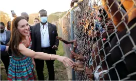  ?? Photograph: Reuters ?? The Duchess of Cambridge shakes hands with children during a visit to Trench Town.