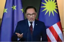  ?? AFP PHOTO ?? STANDING HIS GROUND
Malaysian Prime Minister Anwar Ibrahim speaks during a joint news conference with Germany’s Chancellor Olaf Scholz (not pictured) at the Chanceller­y in the capital Berlin on Monday, March 11, 2024.