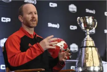  ?? NATHAN DENETTE/THE CANADIAN PRESS ?? Stampeders head coach Dave Dickenson says his conversati­ons with Ottawa’s Rick Campbell made him better.