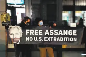  ?? John Thys / AFP / Getty Images 2020 ?? Supporters of WikiLeaks founder Julian Assange rally in December outside the British Embassy in Brussels against his extraditio­n to the United States.