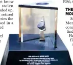  ?? AP PHOTO/JOHN MINCHILLO ?? A moon rock is displayed within a glass case at the Armstrong Air & Space Museum in Wapakoneta, Ohio.