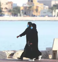  ?? (Reuters) ?? WOMEN WALK in Qatif, Saudi Arabia.