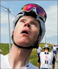 ?? AP/PETER DEJONG ?? Britain’s Chris Froome, the defending Tour de France champion, grimaces after his eyes were treated with eye drops after police used tear gas to disperse a protest by farmers during Tuesday’s 16th stage. The stage restarted after a 15-minute delay.