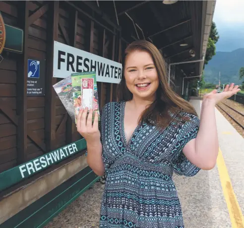  ?? Picture: STEWART McLEAN ?? ON BOARD: Lucy Roods-Smith, of Kanimbla, with the local half-price ticket she was able to snap up for the Kuranda Scenic Railway on Australia Day.