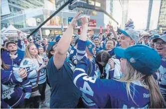  ?? TORONTO STAR FILE PHOTO ?? Fans gather recently outside the Air Canada Centre, where their beloved Toronto Maple Leafs play.