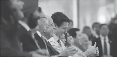  ?? SEAN KILPATRICK / THE CANADIAN PRESS ?? Canadian Prime Minister Justin Trudeau is all smiles as he is introduced during an event at Sina Weibo Headquarte­rs in Beijing this week on a trip to promote Canada-China economic ties.