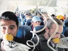  ?? MARTY MARTINEZ THE ASSOCIATED PRESS ?? Marty Martinez, left, is photograph­ed with other passengers on a Southwest Boeing 737 after an engine blew out on Tuesday.