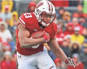  ?? RICK WOOD / MILWAUKEE JOURNAL SENTINEL ?? UW tailback Jonathan Taylor led the Big Ten in rushing last season. Can he do it again?