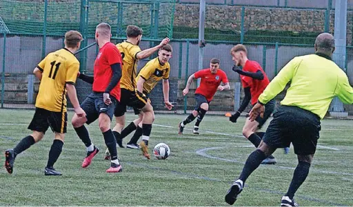  ?? ?? ●●Rochdalian­s (in red) in action against Signol Athletic