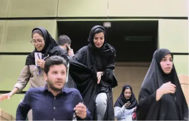  ?? PICTURE: REUTERS ?? EMERGENCY EXIT: Women are seen inside the parliament during an attack in central Tehran, Iran, yesterday.