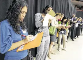  ?? DEBORAH CANNON / AMERICAN-STATESMAN 2011 ?? Prospectiv­e teachers wait to talk with recruiters from various school districts during the University of Texas at Austin’s Teacher Career Fair at the Erwin Center in April 2011. The Austin school district sees turnover of about 800 teachers annually,...