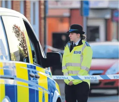  ?? Picture: PA. ?? A police officer guards the area outside the house where the little girl was attacked.